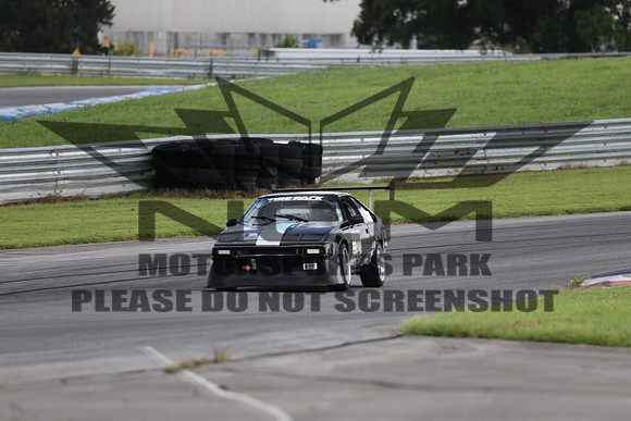 black and white race car number 342-8